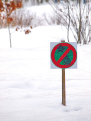  wooden plate with prohibition sign in winter park
