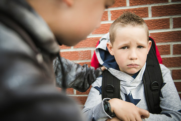 boy problem at school, sitting and consoling child each other