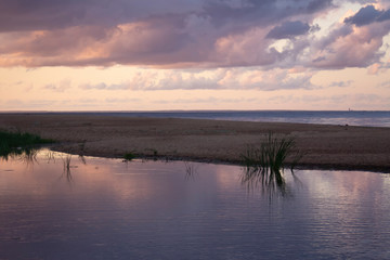 Violet-blue sunset by the sea on a summer evening
