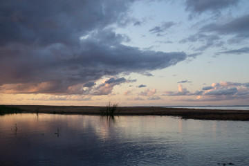 Violet-blue sunset by the sea on a summer evening