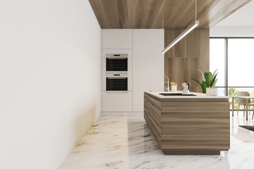 Side view of white and wooden kitchen with island