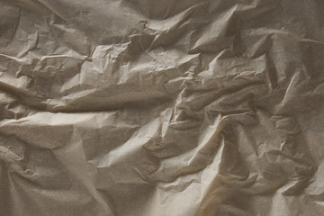 top view of beige wrinkled parchment paper surface with copy space