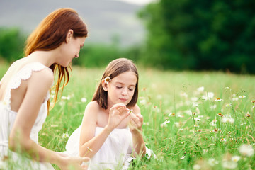 mother and daughter having fun in the park