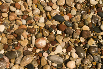 Wet beach pebbles background 