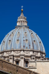 Fototapeta na wymiar Dome of the Papal Basilica of St. Peter in the Vatican seen from the Viale Vaticano
