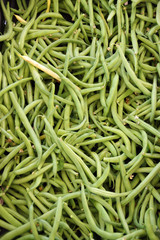 Close-up full frame view of fresh organic green beans displayed at a farmers market stand