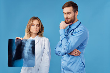 two doctors looking at an xray