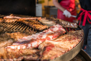 Cooking pork ribs on a grill. Meat on a grills.
