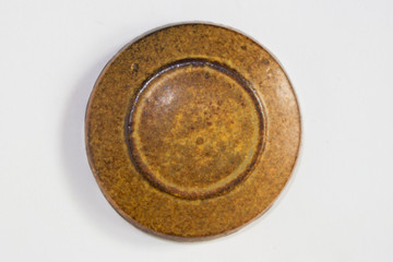 round clay probe with tobacco glossy glaze.
