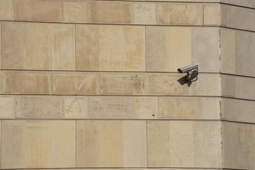                        security camera on the facade of the building in the street
