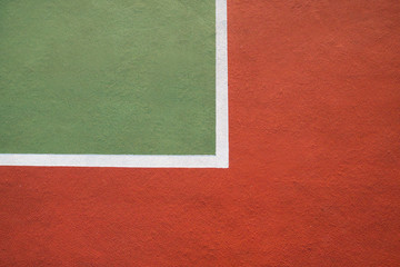 Fototapeta premium Marking on the tennis court close up in red and green color.