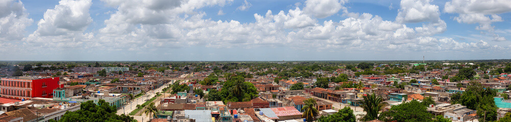 Fototapeta na wymiar Aerial Panoramic view of a small Cuban Town, Ciego de Avila, during a cloudy and sunny day. Located in Central Cuba.