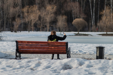 Modern realities - a woman takes a selfie while relaxing