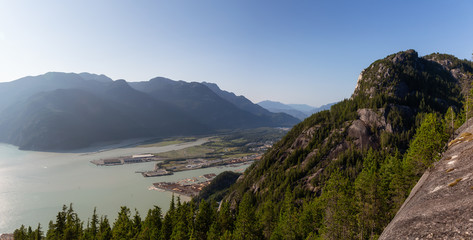 Fototapeta na wymiar Beautiful panoramic Canadian landscape view of a popular landmark, Chief Mountain, during a sunny day. Taken in Squamish, North of Vancouver, BC, Canada.