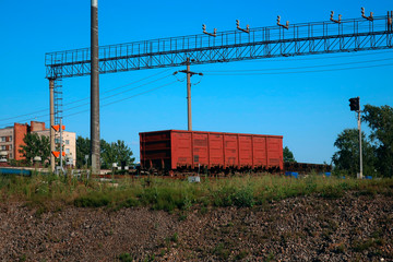 old rusty freight car standing on station tracks