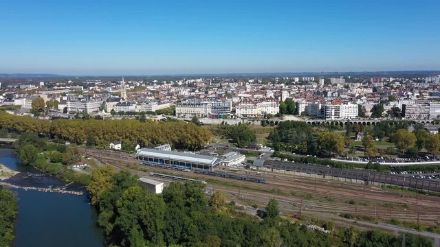 Pau train station aerial back traveling over the river with city in background France