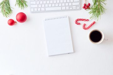 Mockup white notebook with pine branches and keyboard, christmas decorations  on a white background