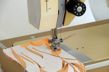the sewing machine is prepared for the process of sewing clothes