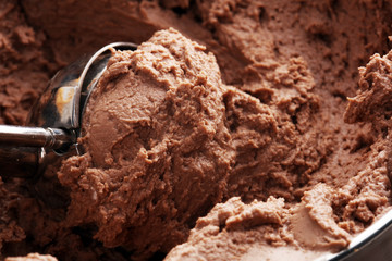 Chocolate coffee ice cream in a bowl on rustic white table
