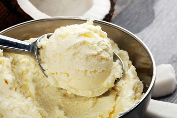 coconut ice cream scoop on a rustic table