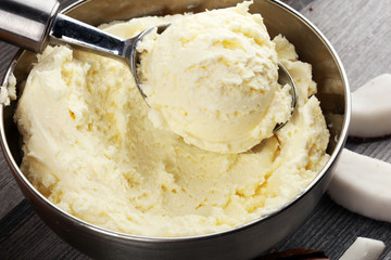coconut ice cream scoop on a rustic table