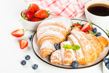 Croissant with chocolate and fresh berries.