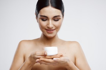 portrait of young woman with clear skin and long hair