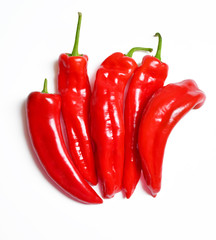An image of a composition of five sweet peppers on a white background 