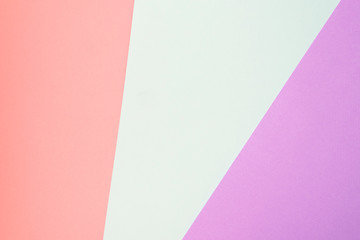 Trendy geometric diagonal abstract texture of pink, violet and blue papers. Design background concept