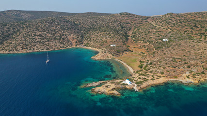 Aerial drone photo of famous turquoise beach of Matezi near port of Katapola featuring picturesque church of Agios Panteleimonas, Amorgos island, Cyclades, Greece