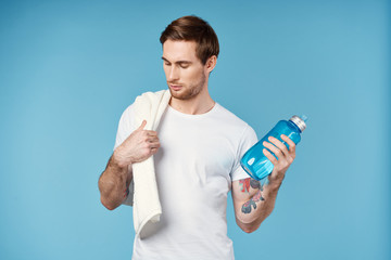 young man drinking water from a bottle