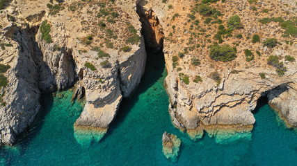 Aerial drone photo of paradise small beach of Mouros with caves and crystal clear sea, Amorgos...