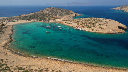 Aerial drone photo of paradise beach of Kalotaritissa with emerald clear sea, Amorgos island,...