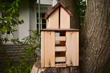 Fototapeta na wymiar House for squirrels in a leisure park.