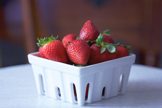 Strawberries In a White Basket Carton