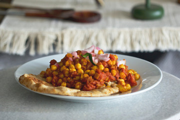 Chana Masala Indian Chickpea Corn Dish with Naan Bread