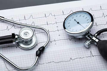 Blood Pressure Gauge And Stethoscope On Cardiogram