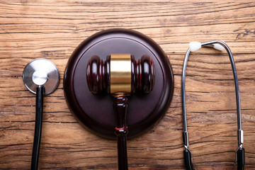 Gavel With Stethoscope Arranged On Table
