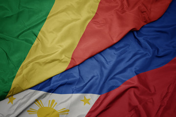 waving colorful flag of philippines and national flag of republic of the congo.