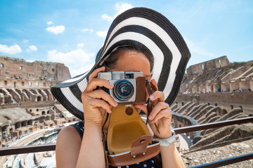 Woman Taking Photo Of Colosseum