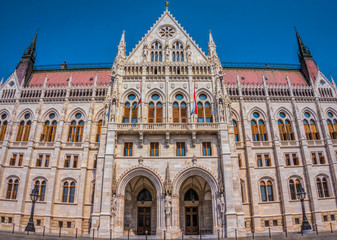 Fototapeta na wymiar Budapest, Hungary - August 29, 2019:Hungarian Parliament building in the city of Budapest. A sample of neo-gothic architecture, Budapest's tourist attraction