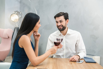Young Man and Woman Sitting in the Restaurant Concept