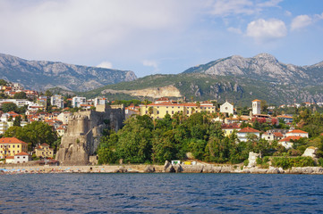 Beautiful Mediterranean landscape. Montenegro. View of Old Town of Herceg Novi city from sea. View of Sea Fortress and Bell tower of Saint Jerome Church