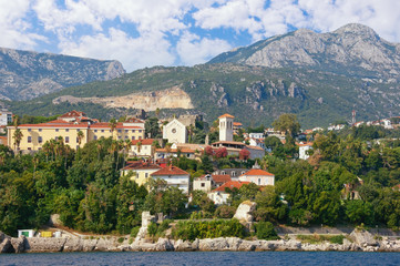 Fototapeta na wymiar Beautiful Mediterranean landscape. Montenegro, Adriatic Sea. View of Old Town of Herceg Novi city from sea. View of Bell tower of Saint Jerome Church