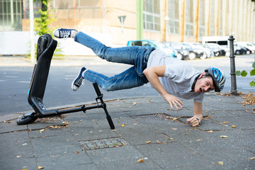 Man Falling From E-Scooter