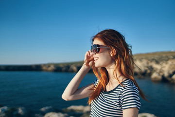 woman with mobile phone on the beach