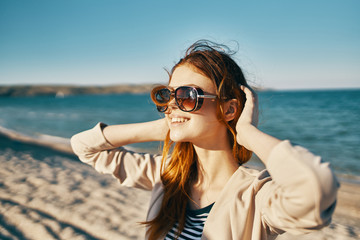 woman with sunglasses on the beach