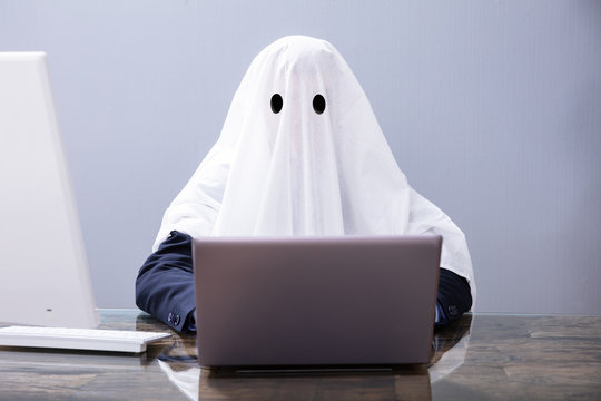 Ghostwriter Writing Article On Laptop