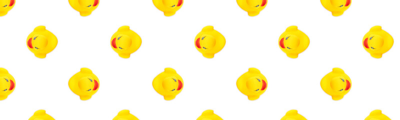 Duck background. Yellow plastic ducks. Yellow seamless pattern