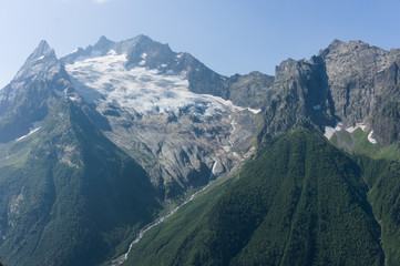 Northern great caucasus mountains near dombay with glaciers and snow in august 2019, original raw picture